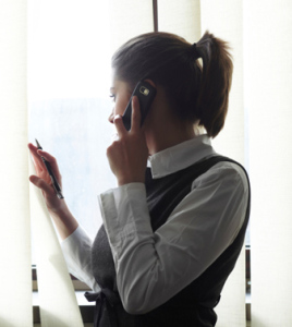 Trapped in the office talking on her phone